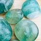 Back view of purple Fluorite palm stone, sourced from Madagascar.