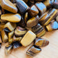 Full profile of Grade A Tiger Eye tumbled stone ready to ship from Beyond Bohemian