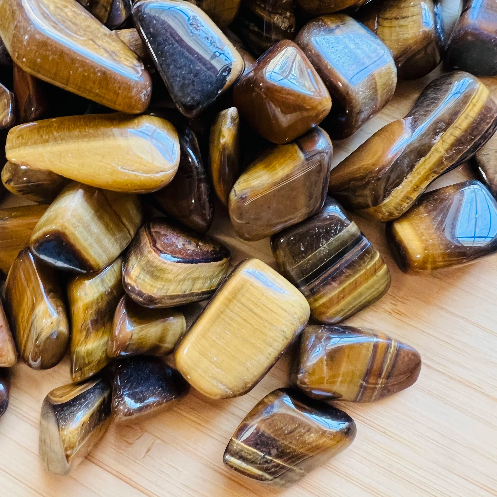 Full profile of Grade A Tiger Eye tumbled stone ready to ship from Beyond Bohemian