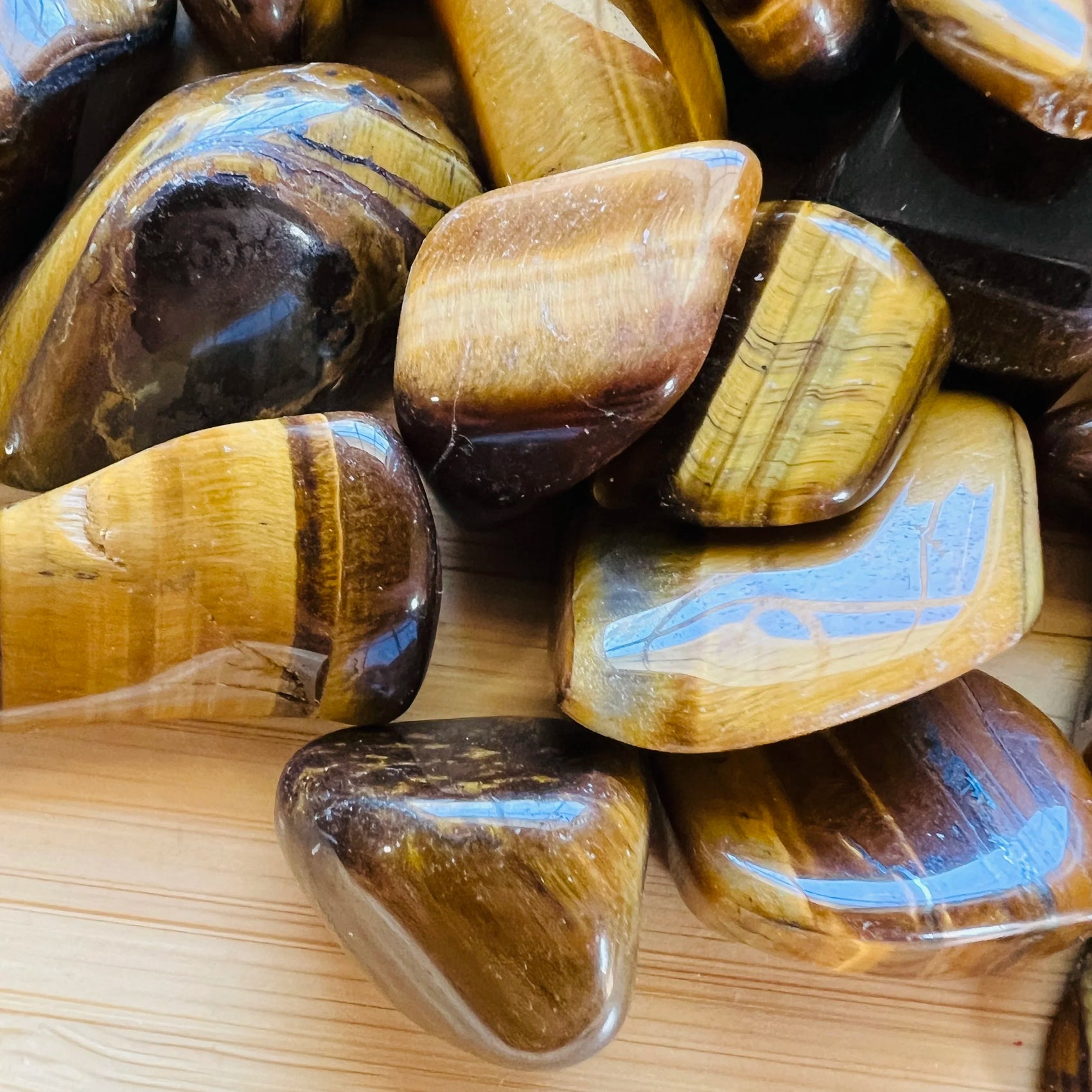Full profile of Grade A Tiger Eye tumbled stone ready to ship from Beyond Bohemian