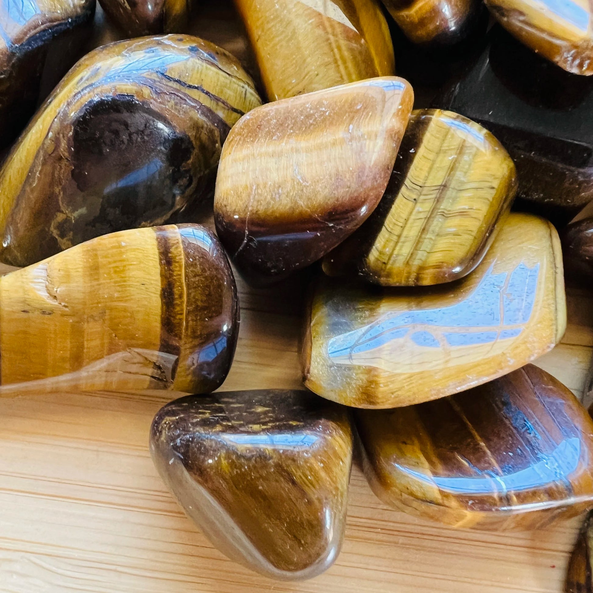 Full profile of Grade A Tiger Eye tumbled stone ready to ship from Beyond Bohemian