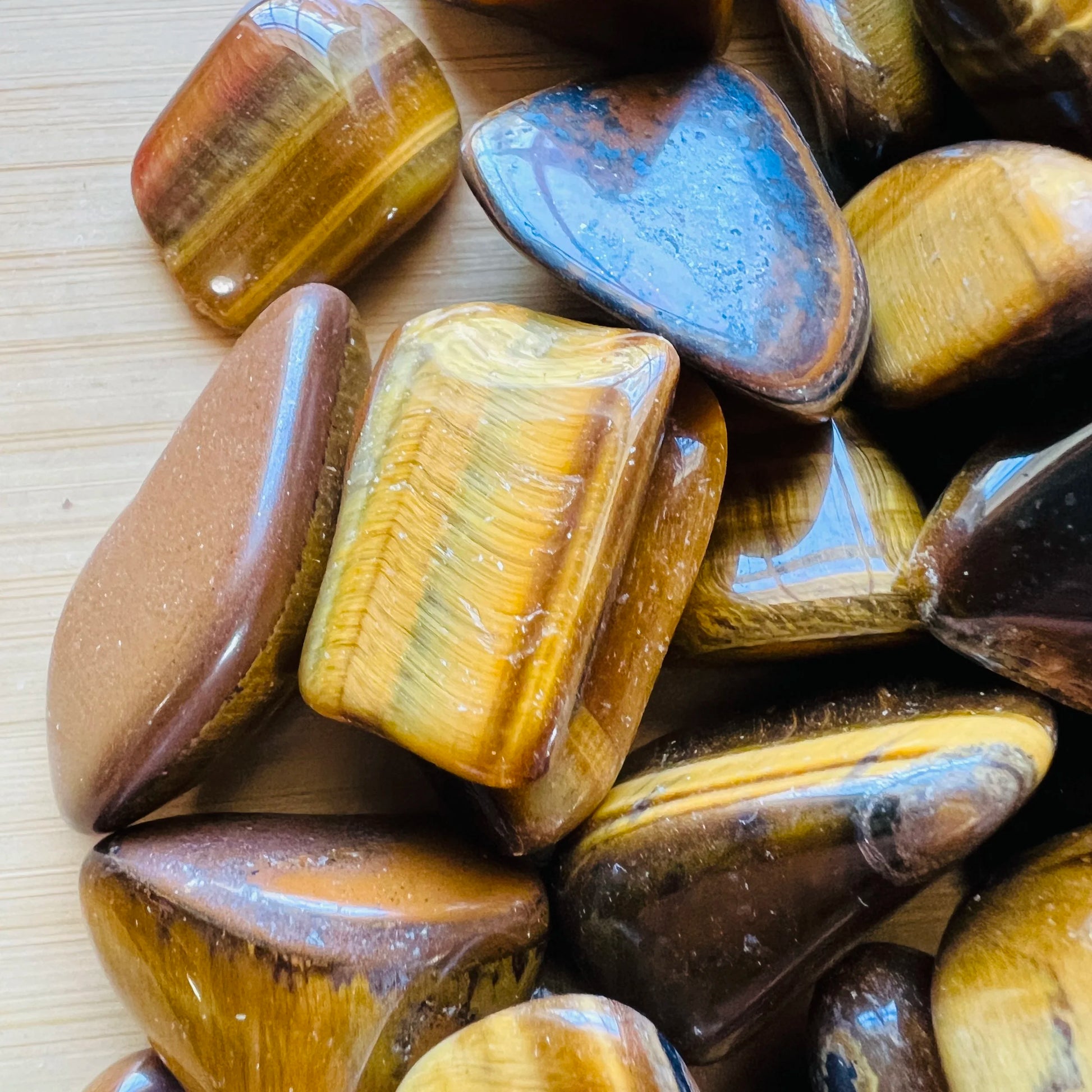 Full profile of Grade A Tiger Eye tumbled stone ready to ship from Beyond Bohemian