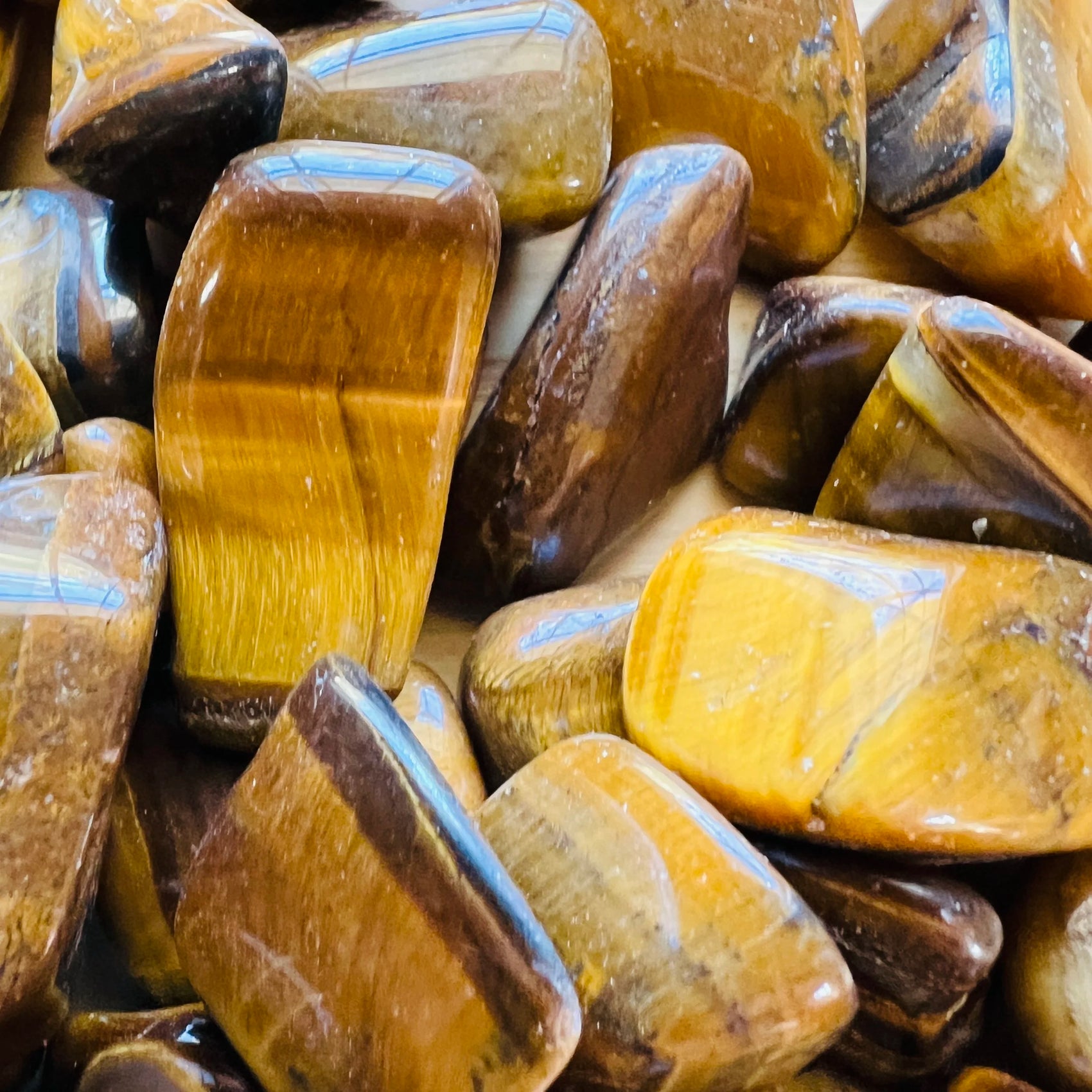 Full profile of Grade A Tiger Eye tumbled stone ready to ship from Beyond Bohemian