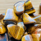 Full profile of Grade A Tiger Eye tumbled stone ready to ship from Beyond Bohemian