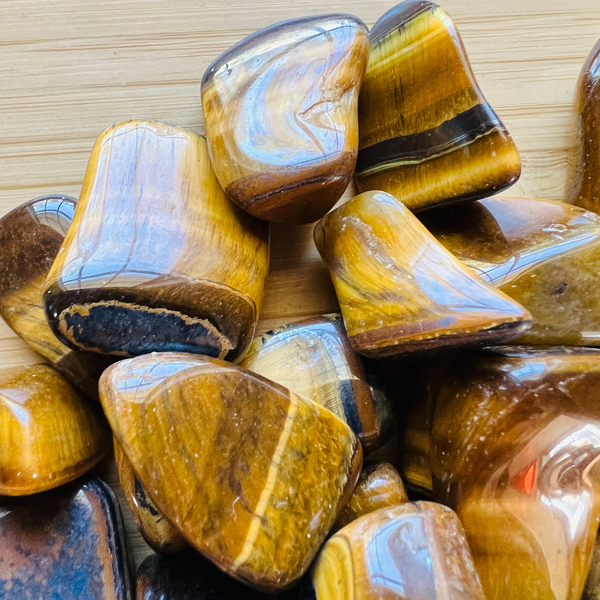 Full profile of Grade A Tiger Eye tumbled stone ready to ship from Beyond Bohemian