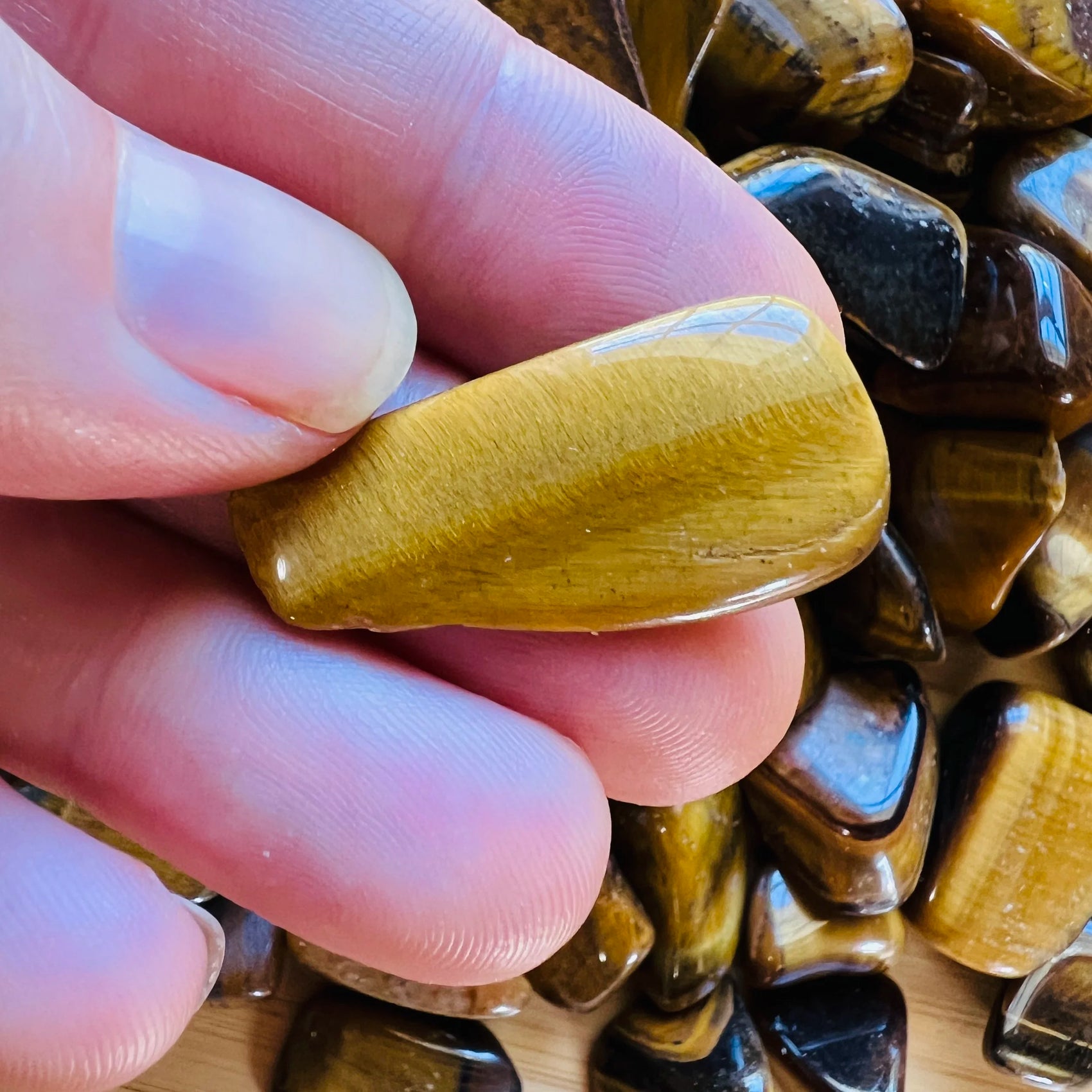 Full profile of Grade A Tiger Eye tumbled stone ready to ship from Beyond Bohemian