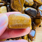 Full profile of Grade A Tiger Eye tumbled stone ready to ship from Beyond Bohemian