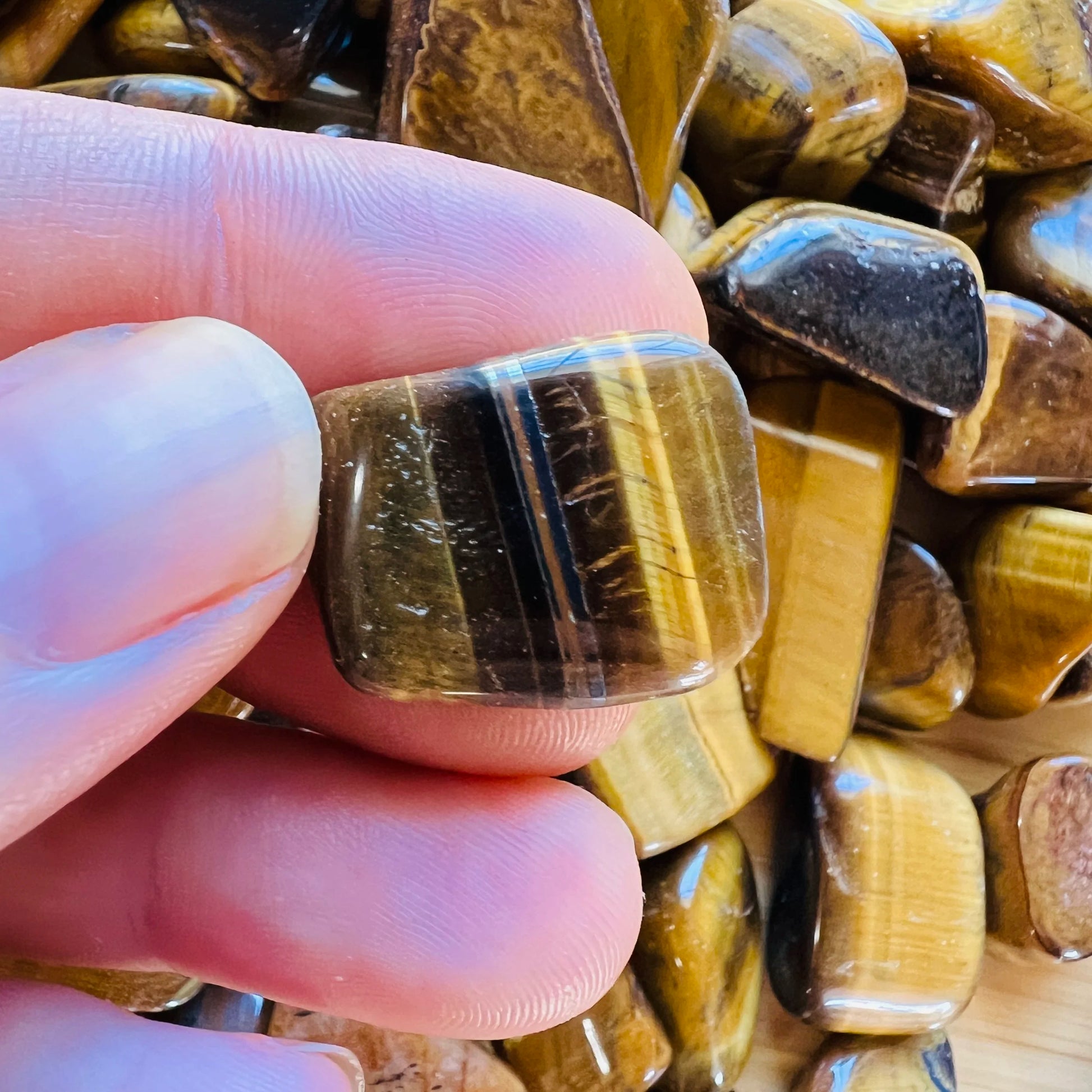 Full profile of Grade A Tiger Eye tumbled stone ready to ship from Beyond Bohemian