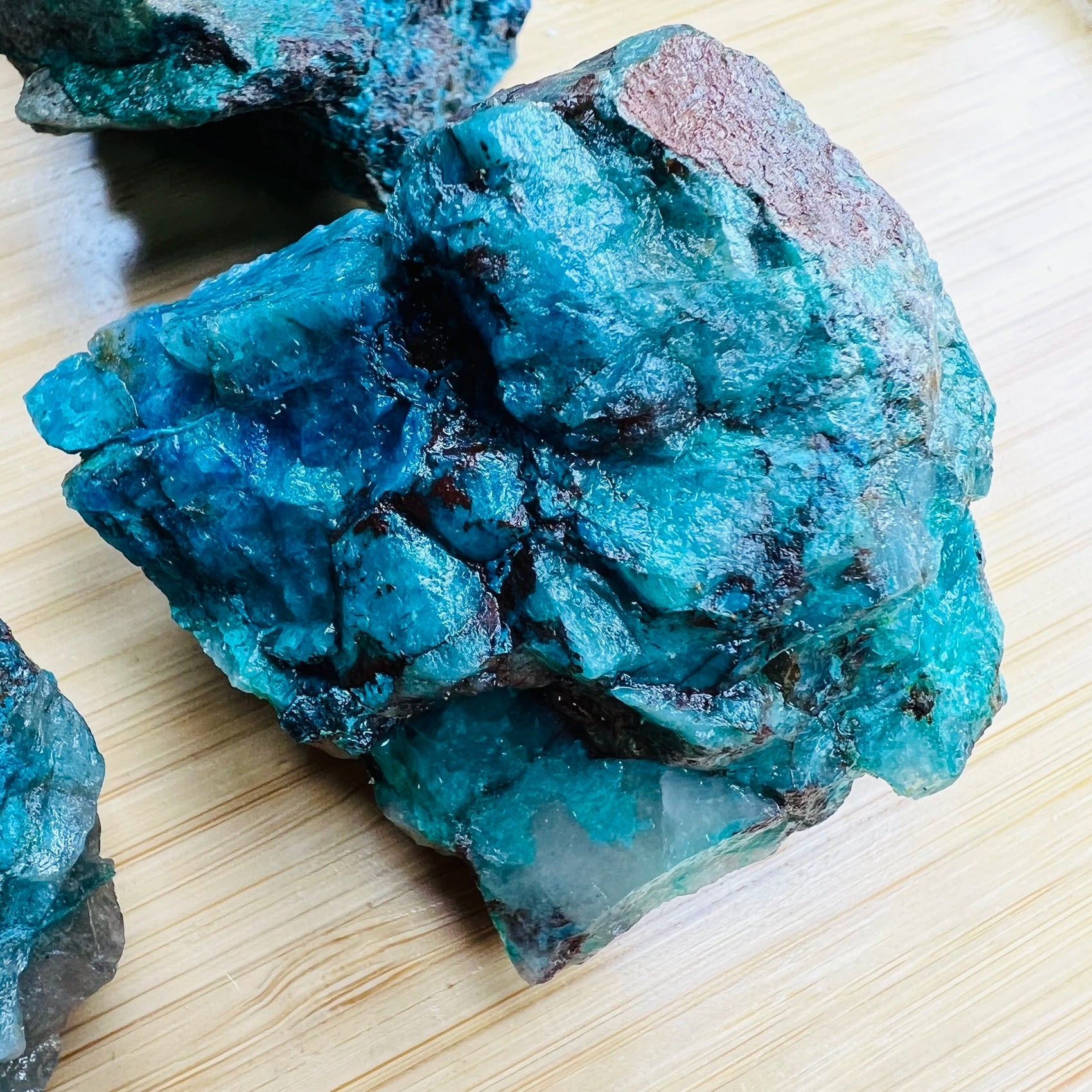 Scale reference of one Chrysocolla raw stone for scale, Namibia-sourced.