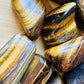 Full profile of Grade A Tiger Eye tumbled stone ready to ship from Beyond Bohemian