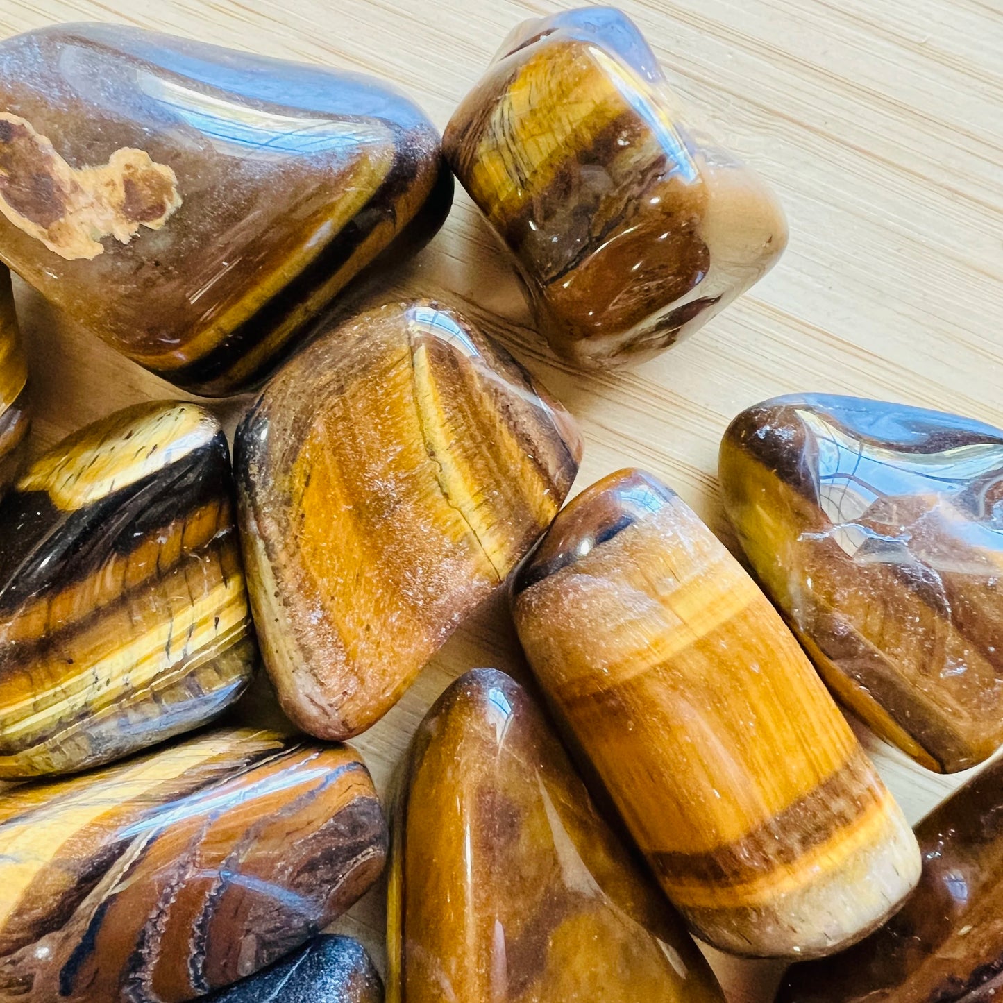 Full profile of Grade A Tiger Eye tumbled stone ready to ship from Beyond Bohemian