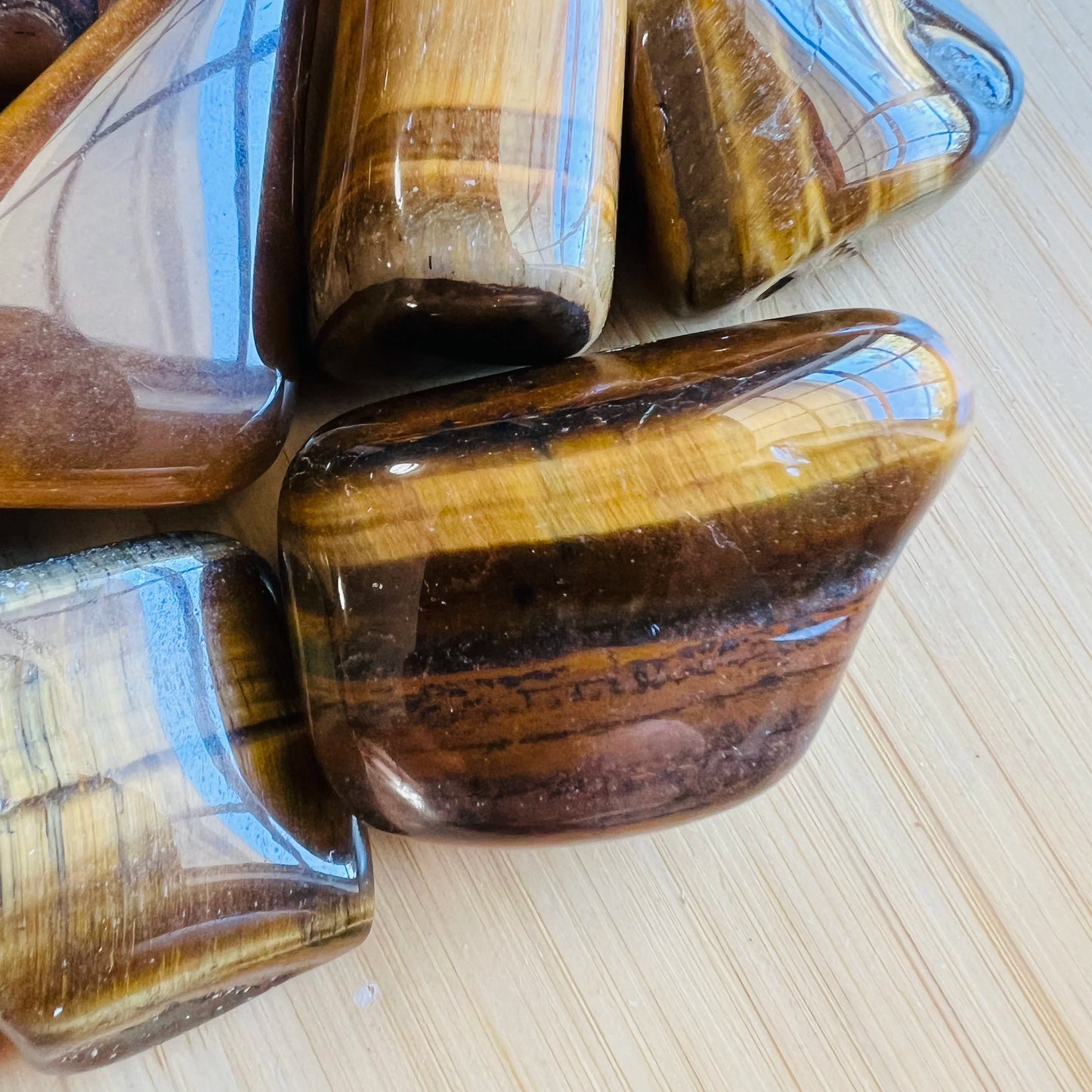 Full profile of Grade A Tiger Eye tumbled stone ready to ship from Beyond Bohemian