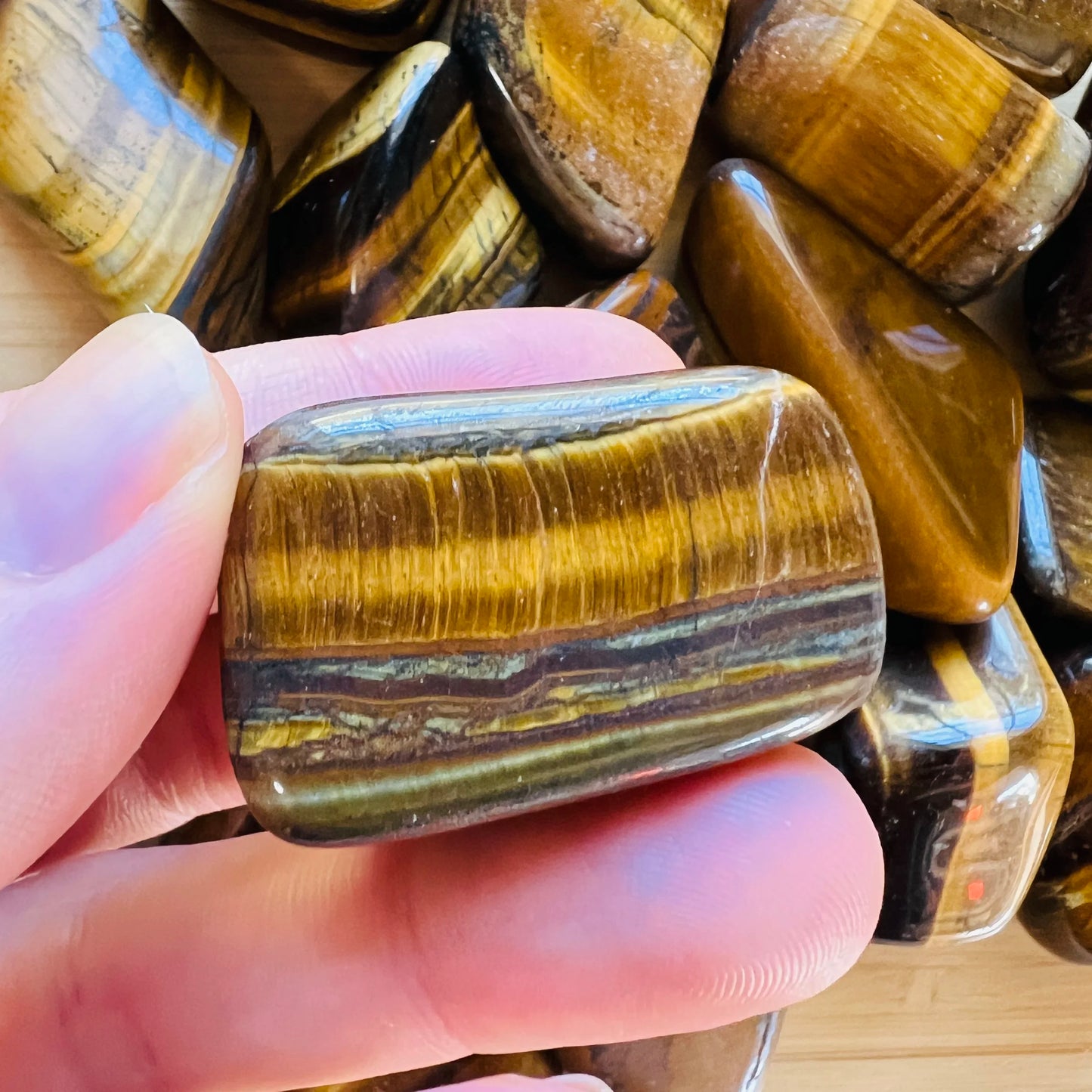 Full profile of Grade A Tiger Eye tumbled stone ready to ship from Beyond Bohemian