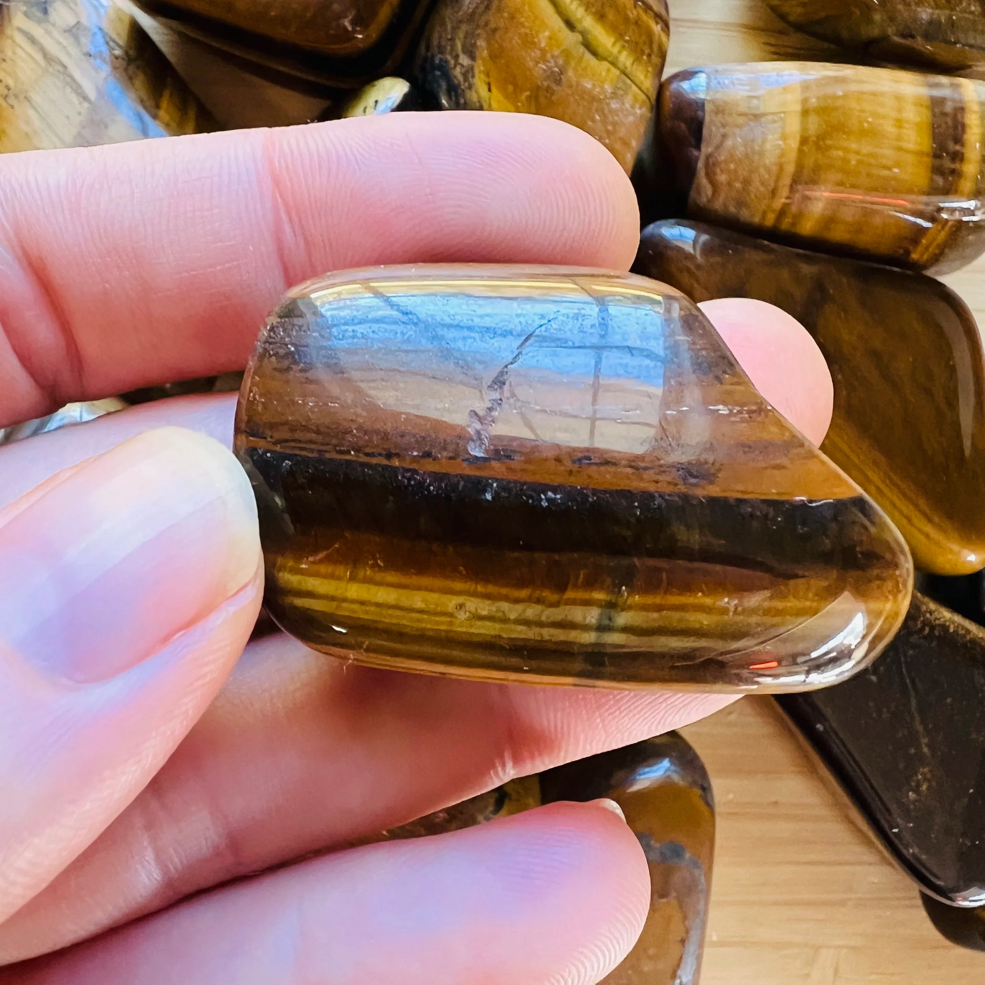 Full profile of Grade A Tiger Eye tumbled stone ready to ship from Beyond Bohemian