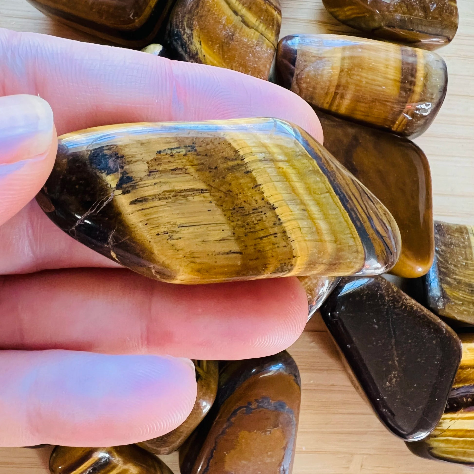 Full profile of Grade A Tiger Eye tumbled stone ready to ship from Beyond Bohemian
