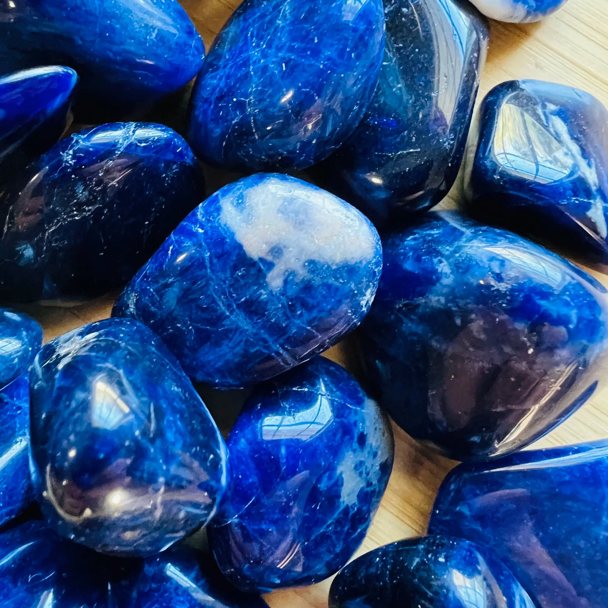 Profile shot of Sodalite tumbled stone, showing natural texture, drawn on for Focus.