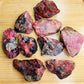 Full profile of Grade AA Rhodonite raw ready to ship from Beyond Bohemian