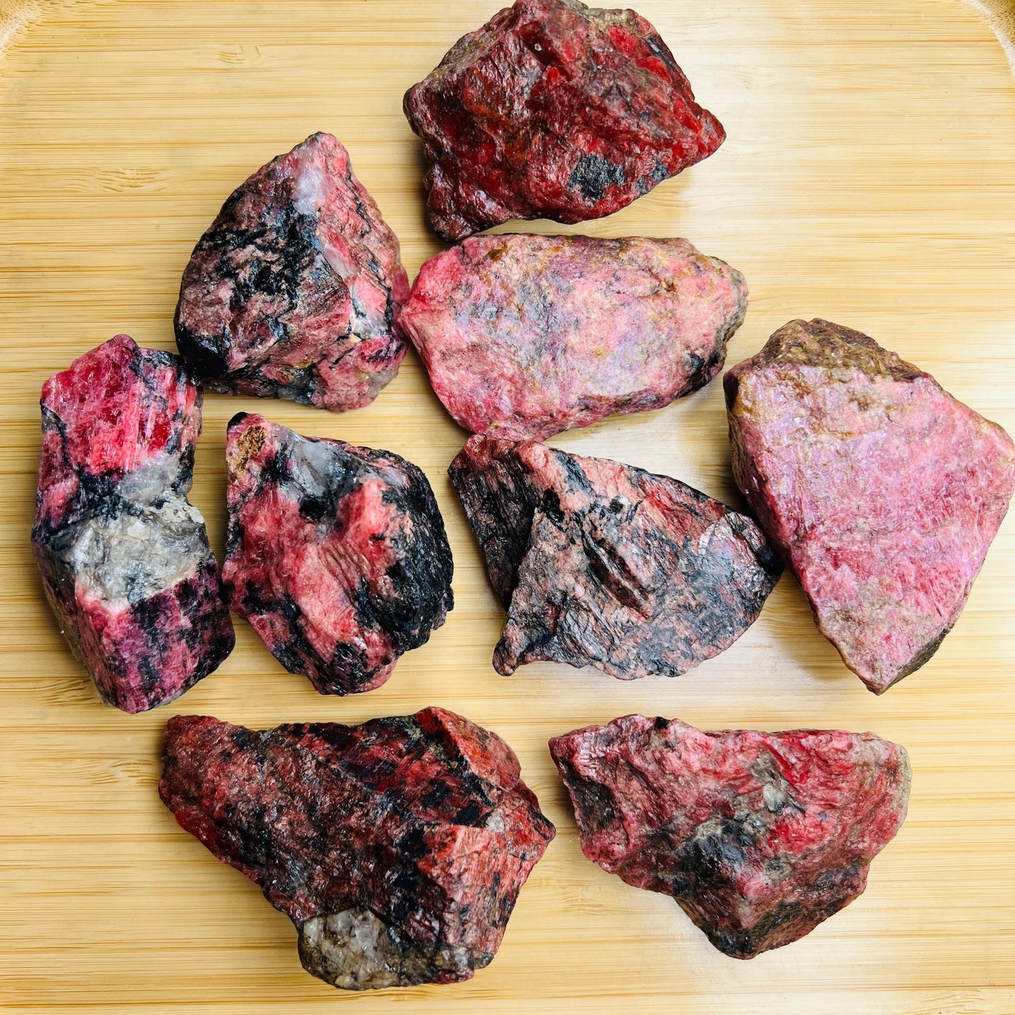 Full profile of Grade AA Rhodonite raw ready to ship from Beyond Bohemian