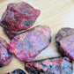 Full profile of Grade AA Rhodonite raw ready to ship from Beyond Bohemian