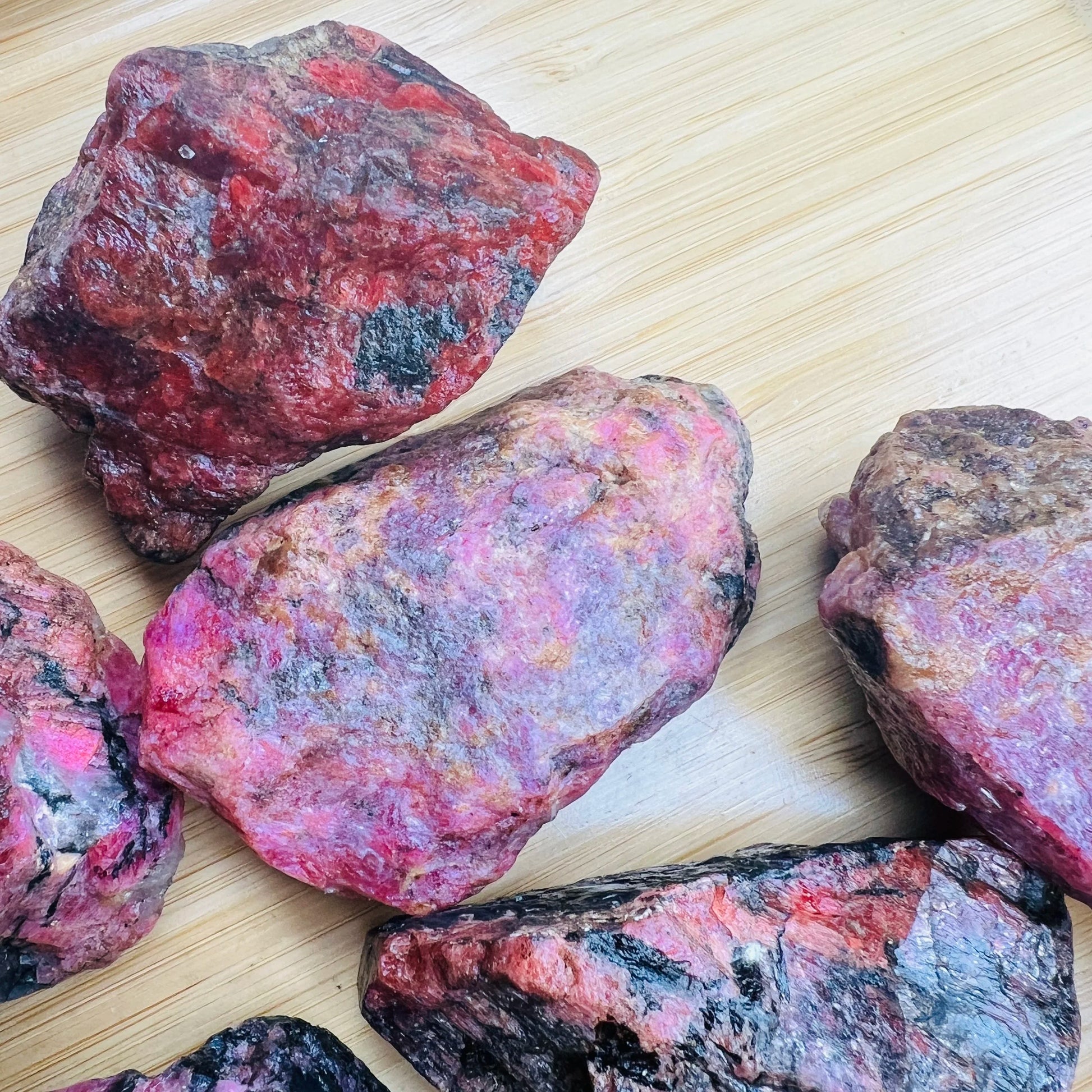 Full profile of Grade AA Rhodonite raw ready to ship from Beyond Bohemian