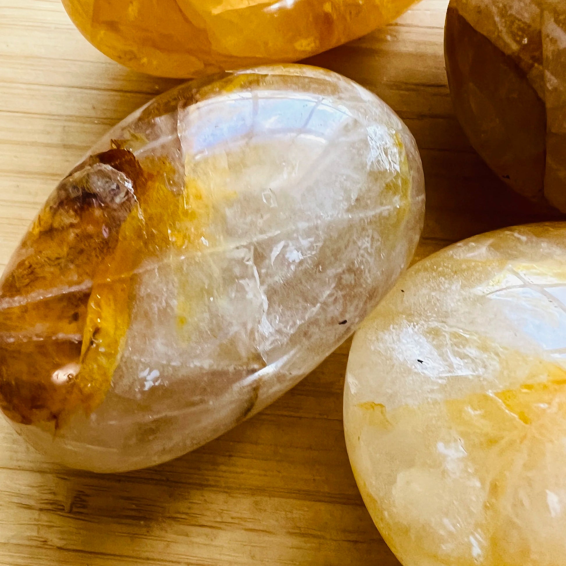Overhead view of Golden Healer palm stone, turned to for Healing, showing earthy tone.