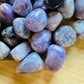 Close detail of Lepidolite tumbled stone, to support Stress Relief, sourced from Erongo, Namibia.