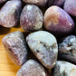 Side angle of Lepidolite tumbled stone, showing characteristic finish.