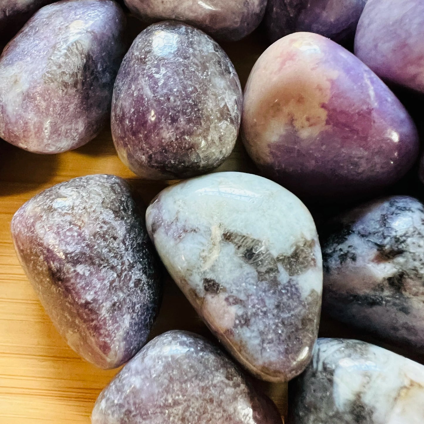Side angle of Lepidolite tumbled stone, showing characteristic finish.