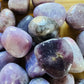 Bottom side of Lepidolite tumbled stone, turned to for Stress Relief and Emotional Healing.