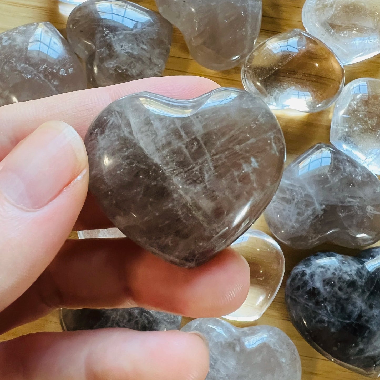 Texture-level view of Smoky Quartz polished heart, drawn on for Grounding, from Madagascar.
