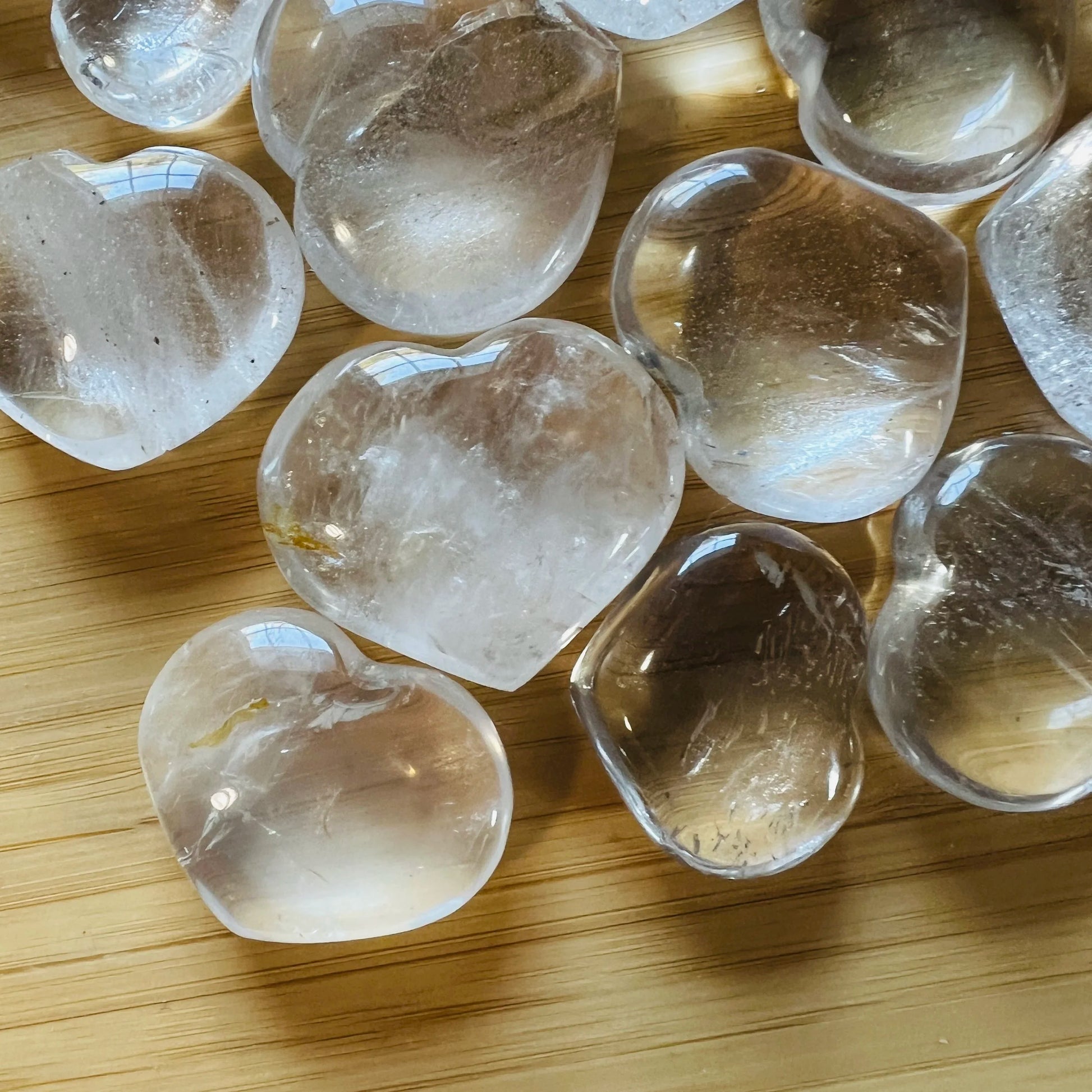 Side-on view of Grade AA Clear Quartz polished heart, often paired with practices around Cleansing and Meditation, showing.