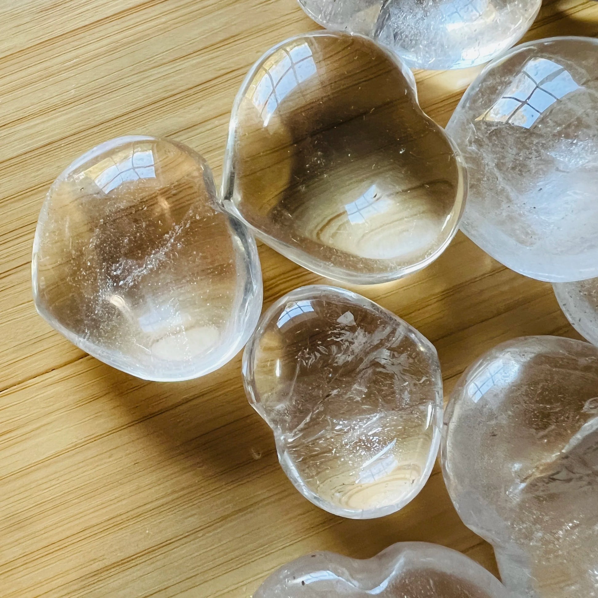 Overhead view of Clear Quartz polished heart, showing natural sheen.