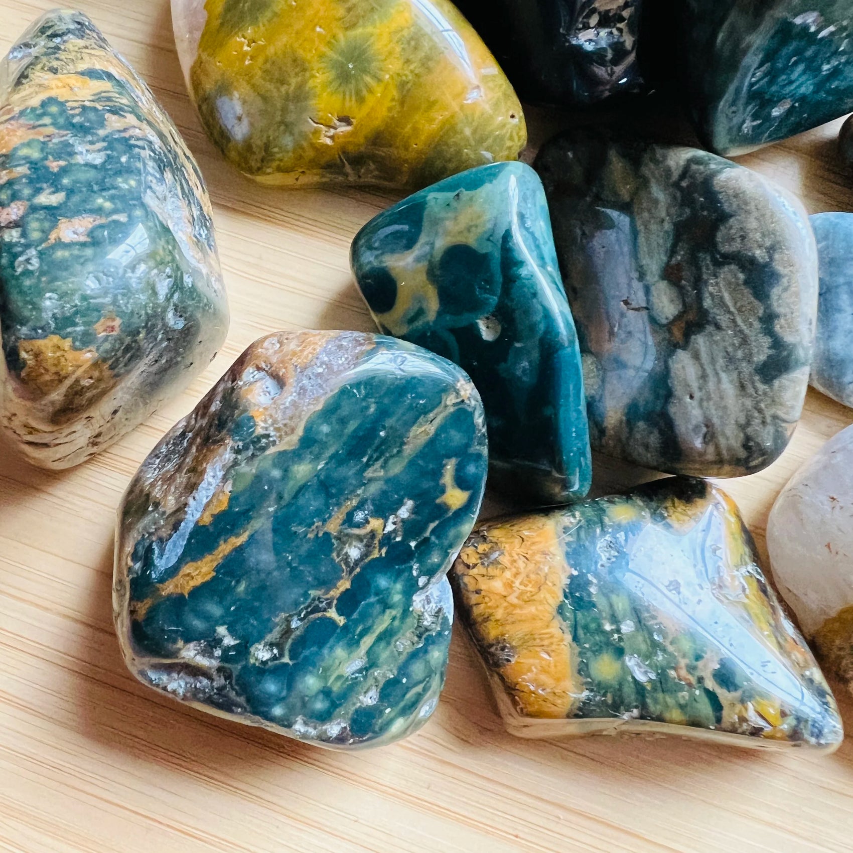 Underside detail of Ocean Jasper tumbled stone, associated with Emotional Healing, showing characteristic patterning.