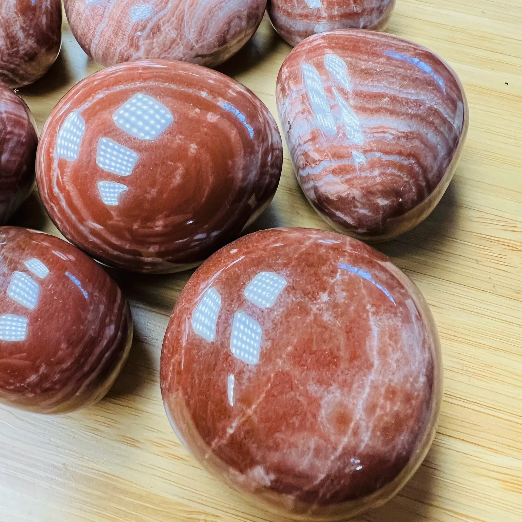 Full profile of Grade AAA Red Aragonite tumbled stone ready to ship from Beyond Bohemian