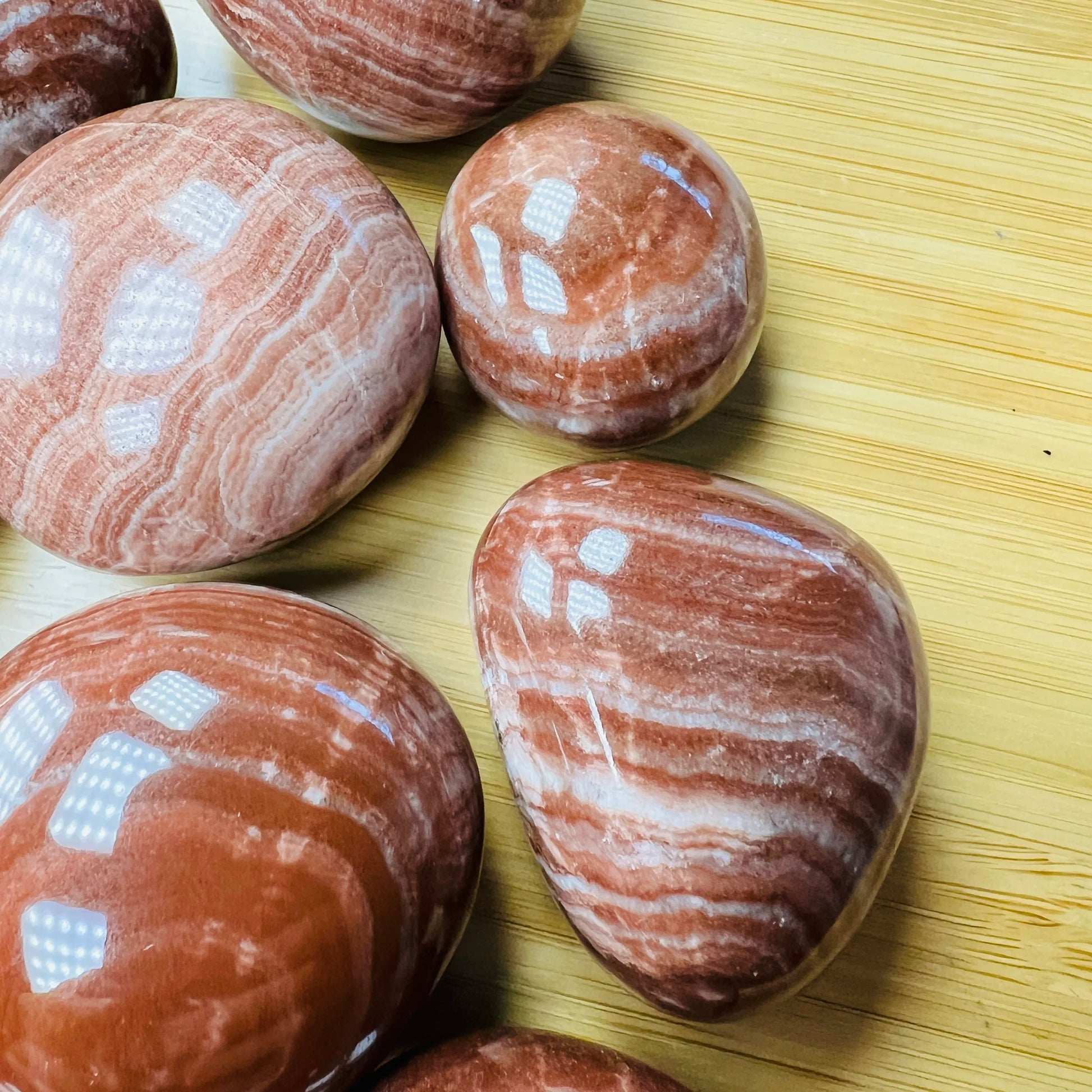 Full profile of Grade AAA Red Aragonite tumbled stone ready to ship from Beyond Bohemian