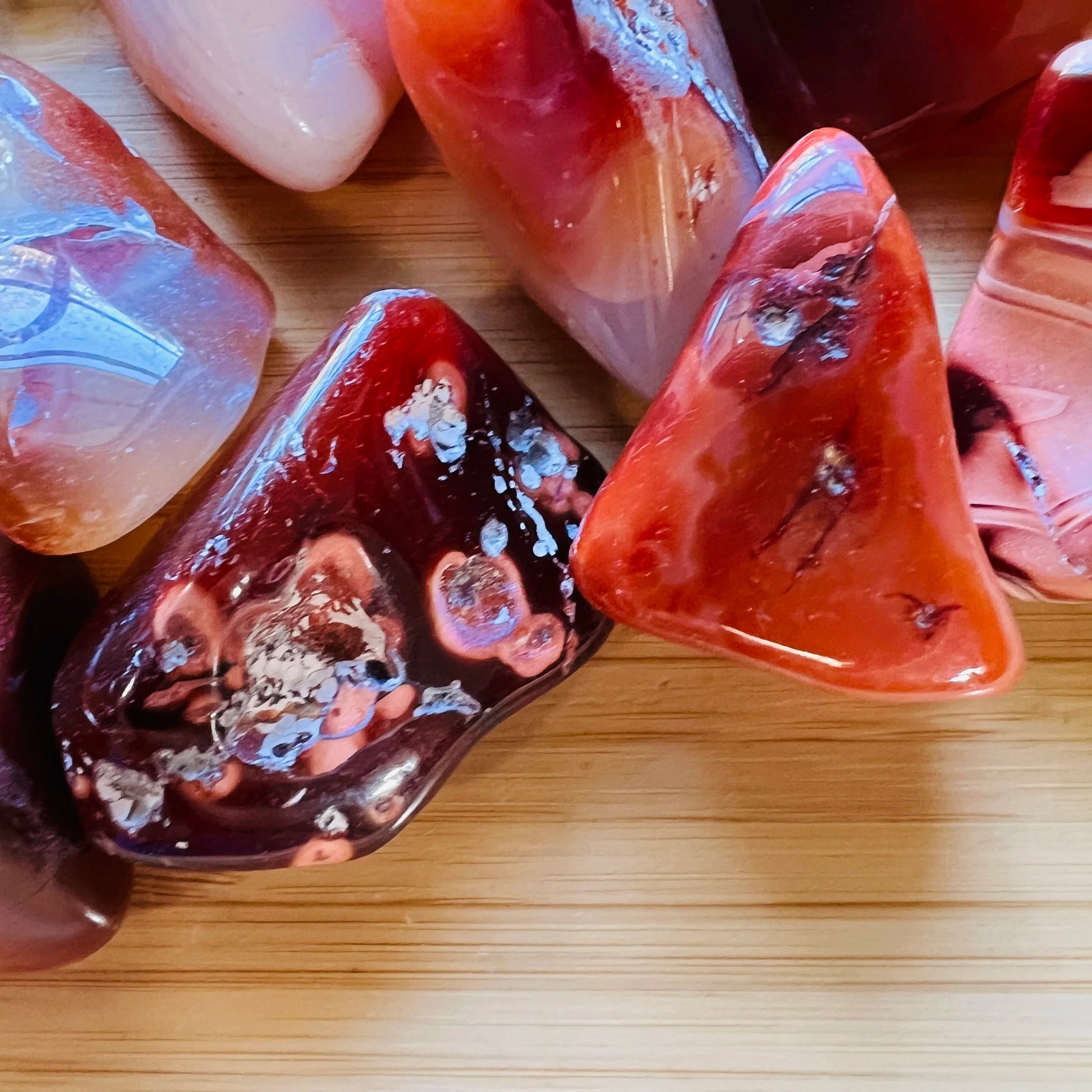 Alternate angle of Grade AA Carnelian tumbled stone showing overall shape