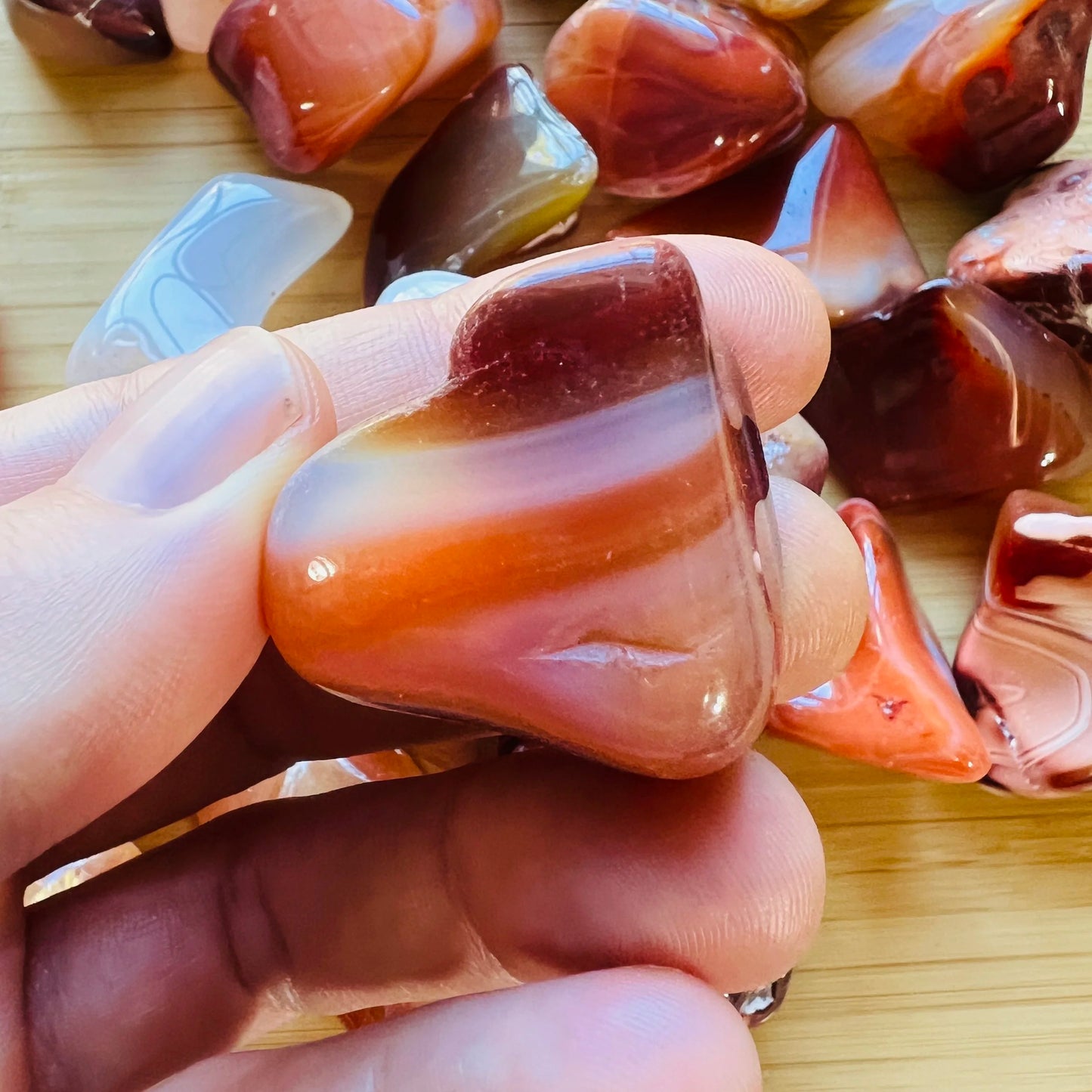 Base detail of Grade AA Carnelian tumbled stone