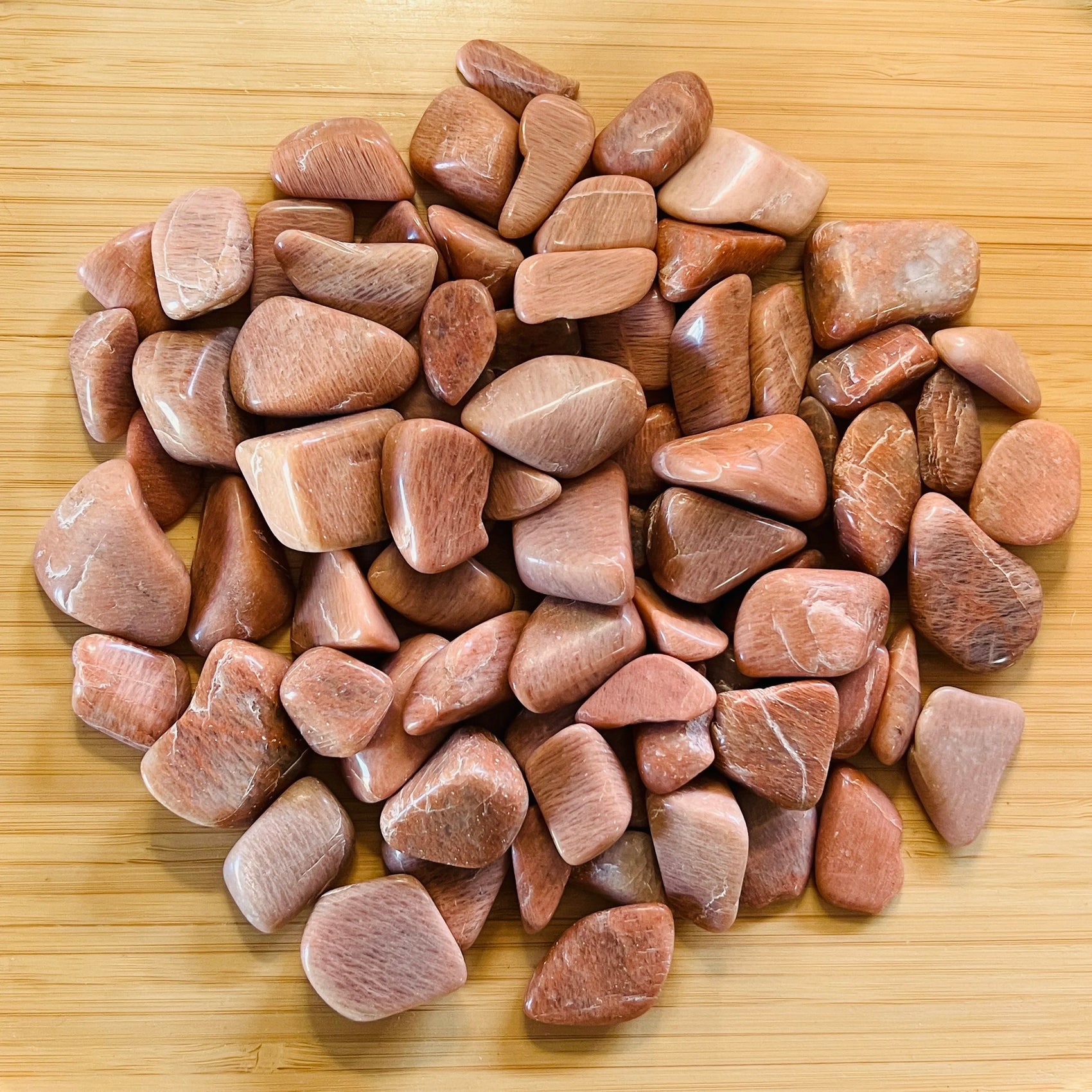 Peach Moonstone tumbled stone in Peach tones, ethically sourced from Madagascar for Emotional Healing and Stress Relief