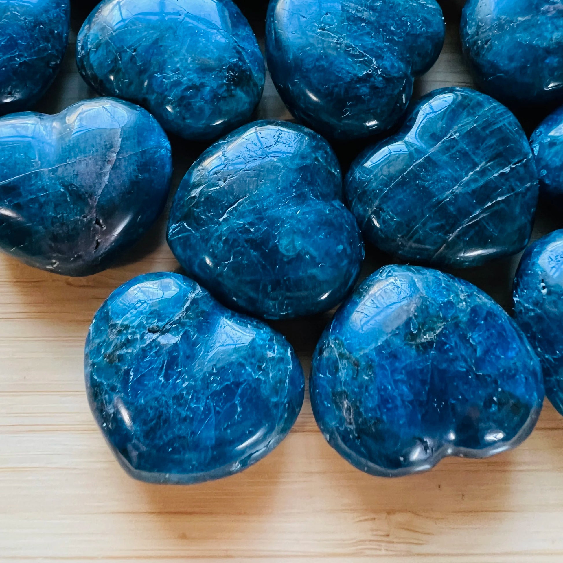 Close-up of Apatite polished heart, showing earthy tone, from Madagascar.