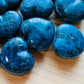 Bird's-eye view of Apatite polished heart, showing soft luster, hand-selected from Anosy, Madagascar.