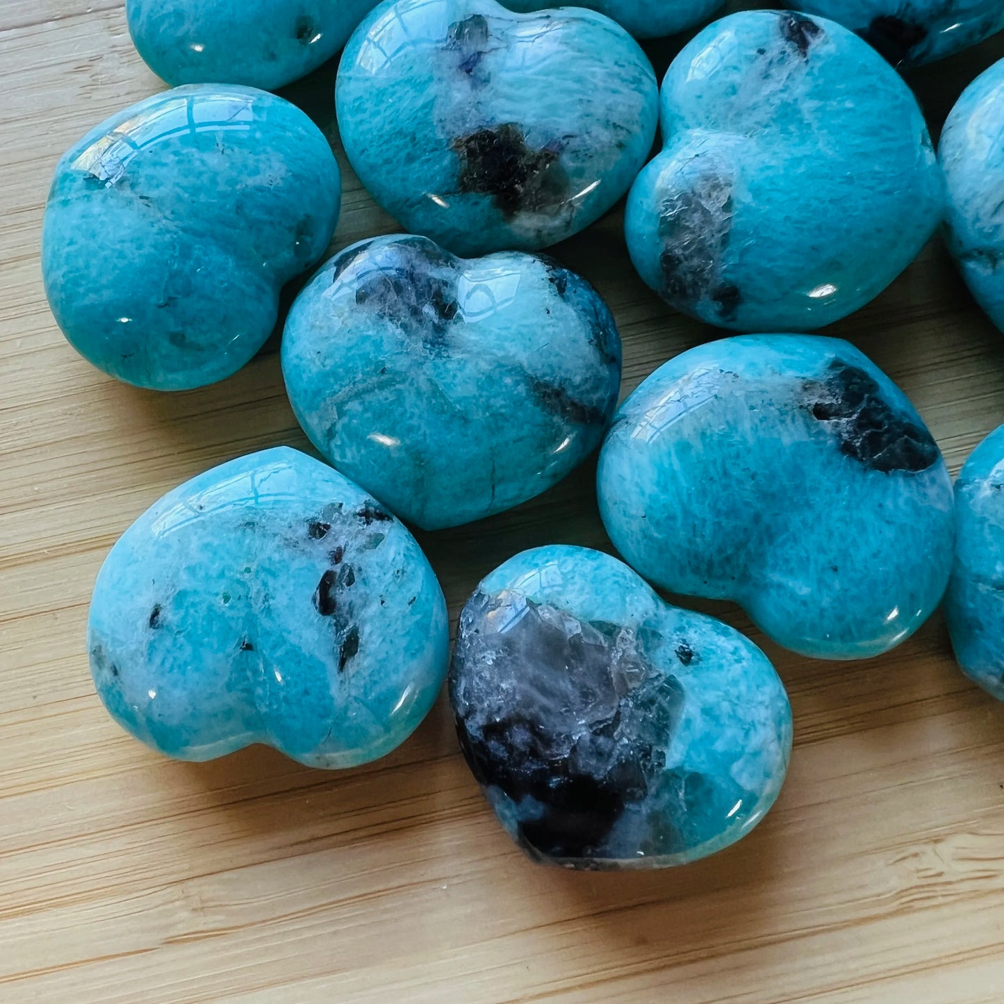 Texture-level view of Amazonite polished heart, showing natural variation.