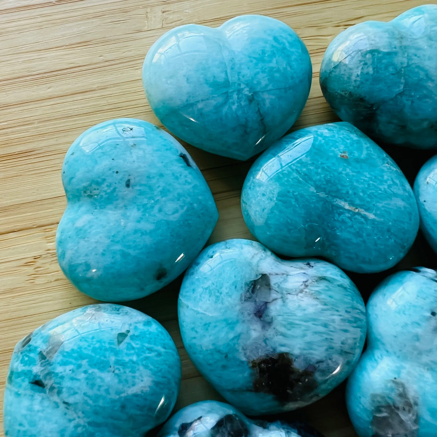 Top-side view of Grade AA Amazonite polished heart, showing characteristic patterning.