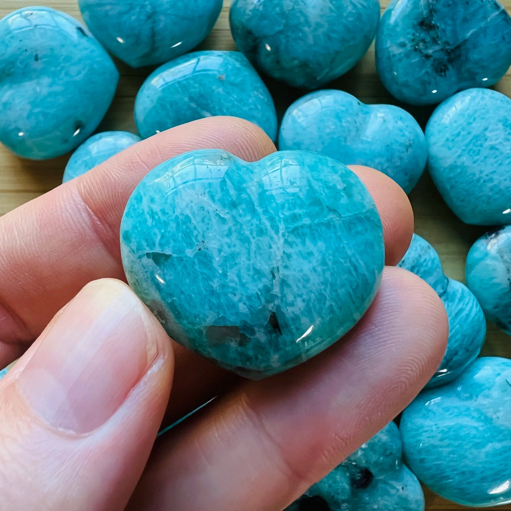 Close-up of Amazonite heart carving from Madagascar, soothing wellness stone for Emotional Healing