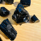 Reverse side of Grade AAA Black Tourmaline raw stone, Madagascar-sourced, often worked with for Protection.