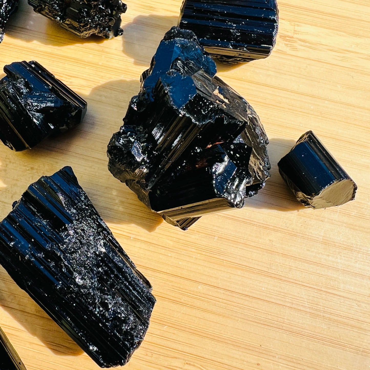 Reverse side of Grade AAA Black Tourmaline raw stone, Madagascar-sourced, often worked with for Protection.