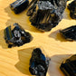 Alternate angle of Grade AAA Black Tourmaline raw showing overall shape
