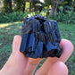 Detail shot of Grade AAA Black Tourmaline raw under natural light