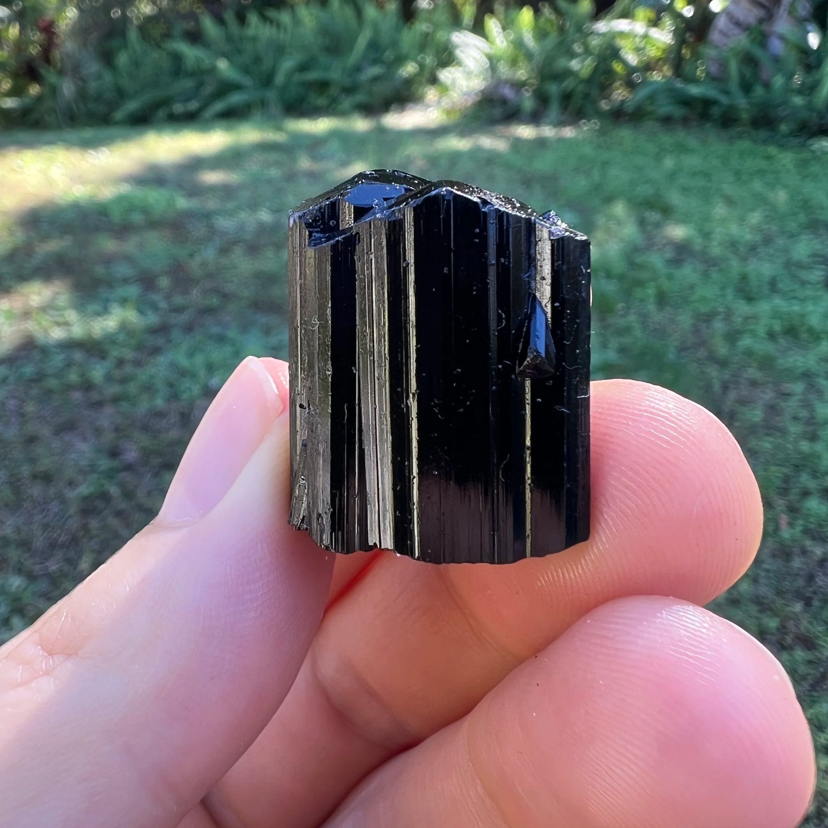 Close-up of Black Tourmaline raw crystal from Madagascar, soothing wellness stone for Stress Relief