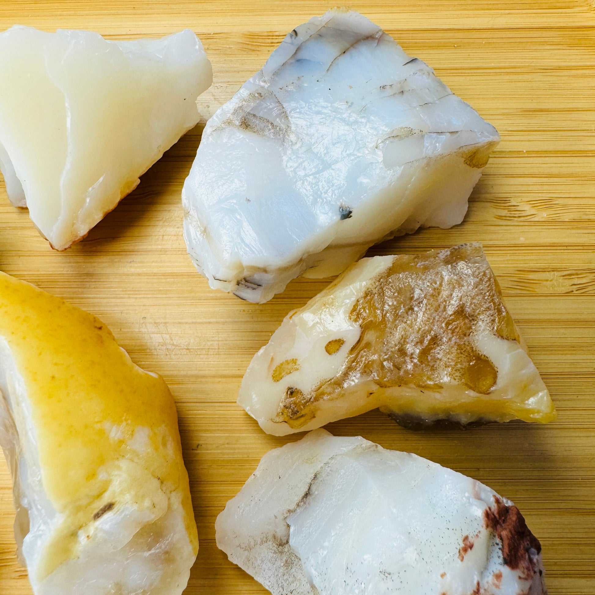 Texture-level view of White Opal raw stone, sourced from Brazil, to support Intuition.