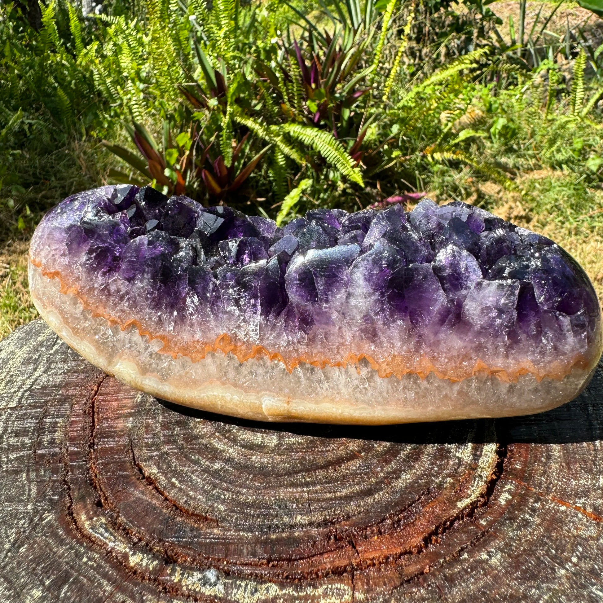 Detail capture of Grade AAA purple Amethyst raw geode, sourced from Uruguay, showing natural sheen.